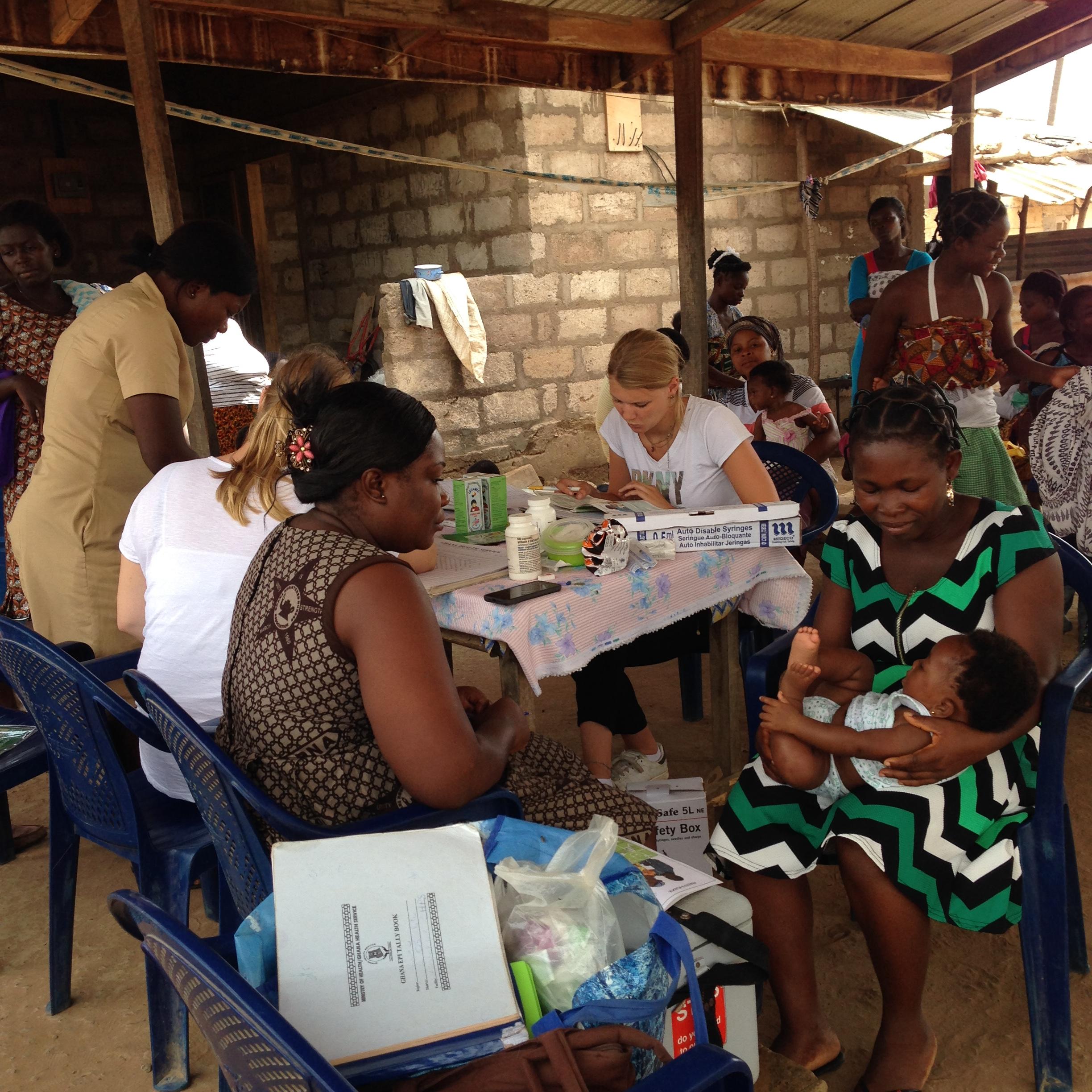 A Midwifery intern participates in a community outreach attended mainly by women in Ghana. Local women attend a community outreach and receive treatment from Projects Abroad Midwifery and other medical interns in Ghana.